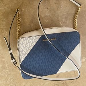 a blue and white Mk crossbody bag